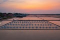 Aerial view of heaps of raw sea salt piles with sea. Farm field outdoor. Nature material in salt traditional industry in Thailand Royalty Free Stock Photo