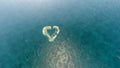 Aerial view of a heart-shaped wih love island.