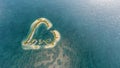 Aerial view of a heart-shaped wih love island.