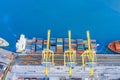 Aerial view from the height of the port dock, moored cargo ship arriving from the ocean in anticipation of unloading containers Royalty Free Stock Photo