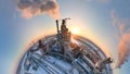 Aerial view from high altitude of little planet earth with cement factory tower with high concrete plant structure at Royalty Free Stock Photo