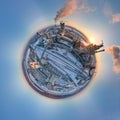 Aerial view from high altitude of little planet earth with cement factory tower with high concrete plant structure at Royalty Free Stock Photo