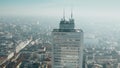 Aerial view of high rise building roof and Milan cityscape. Lombardy, Italy