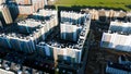Aerial view of high rise buildings, new residential district, increasing population concept. Journey. Flying above the Royalty Free Stock Photo