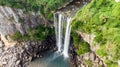 Aerial View of The High Waterfall Jeongbang and Lagoon on Jeju Island Royalty Free Stock Photo