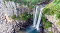 Aerial View of The High Waterfall Jeongbang and Lagoon on Jeju Island Royalty Free Stock Photo