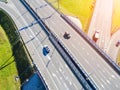 Aerial view of highway in city. Cars crossing interchange overpass. Highway interchange with traffic. Aerial bird`s eye photo of h