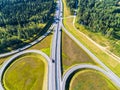 Aerial view of highway in city. Cars crossing interchange overpass. Highway interchange with traffic. Aerial bird`s eye photo of