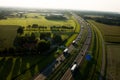Aerial view of a highway with green fields