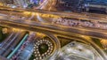 Aerial view of highway interchange in Dubai downtown night timelapse.