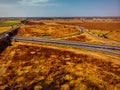 Aerial view of highway interchange of a small city in open space Royalty Free Stock Photo