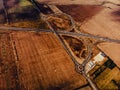 Aerial view of highway interchange of a small city in open space Royalty Free Stock Photo