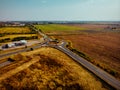 Aerial view of highway interchange of a small city in open space Royalty Free Stock Photo