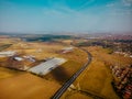 Aerial view of highway interchange of a small city in open space Royalty Free Stock Photo