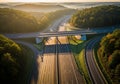 Aerial view of a highway interchange surrounded by dense forest. Multiple lanes are visible, Royalty Free Stock Photo