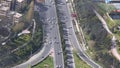 Traffic jam concept. Cars and lorries wait for their turn to move. Aerial view of highway interchange.