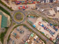 Aerial view of highway junctions with roundabout and containers. Bridge roads shape circle in structure in logistic transportation Royalty Free Stock Photo