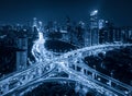 Aerial view of highway junctions shape letter x cross at night. Bridges, roads, or streets in connection or transportation concept