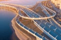 Aerial view highway loop over a road junction in the evening at sunset Royalty Free Stock Photo