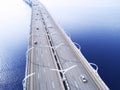 Aerial view of highway in the ocean. Cars crossing bridge interchange overpass. Highway interchange with traffic. Aerial bird`s ey Royalty Free Stock Photo