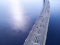 Aerial view of highway in the ocean. Cars crossing bridge interchange overpass. Highway interchange with traffic. Aerial bird`s ey Royalty Free Stock Photo