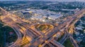 Aerial view highway road intersection at dusk for transportation, distribution or traffic background Royalty Free Stock Photo