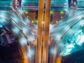 Aerial view highway road intersection at night for transportation, distribution or traffic background