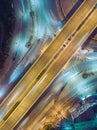 Aerial view highway road intersection at night for transportation, distribution or traffic background Royalty Free Stock Photo