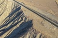 Aerial view of highways built alongside cliffs and desert slopes with good geometric design Royalty Free Stock Photo