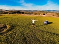 Aerial view of hiker man with arms outstretched celebrating praying in beautiful sunrise with mountains. Royalty Free Stock Photo