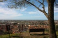 Aerial view from a hill. a quiet, green, quiet and peaceful public park. a solitary bench, a tree and a view of the town