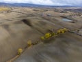 Aerial view on hills of Tuscany, Italy. Tuscan landscape with ploughed fields in autumn Royalty Free Stock Photo