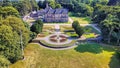 Aerial view of the historic Bangor Castle surrounded by lush green landscape in Northern Ireland.