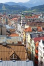 Aerial view of historic town center with colorful house facades and roofs, the bell tower of the Hospital Church of Holy Ghost and