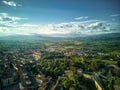 Aerial view of the historic Tuscan city skyline under a bright sky in Arezzo, Italy