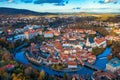 Aerial view of historical centre of Cesky Krumlov town on Vltava riverbank on autumn day overlooking medieval Castle, Czech