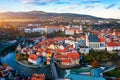 Aerial view of historical centre of Cesky Krumlov town on Vltava riverbank on autumn day overlooking medieval Castle, Czech