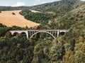 Aerial view of historical stone railway bridge in Slovakia. High, fully preserved stone arch railway bridge.