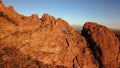 Aerial view of a hole on giant rock formation on sunset sky background Royalty Free Stock Photo