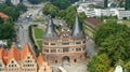 Aerial view of Holsten Gate or Holstentor in old town, beautiful architecture, sunny day, Lubeck, Germany Royalty Free Stock Photo