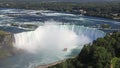 Aerial view of Horseshoe Falls including Hornblower Boat sailing on Niagara River, Canada and USA natural border Royalty Free Stock Photo