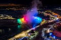 Horseshoe Falls winter illumination in twilight time. Niagara Falls City downtown horizon. Stunning landscape dusk to night. Royalty Free Stock Photo