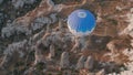 Aerial view from hot air balloon during Sunrise over the fairytale landscape hills of Kapadokya with morning light.