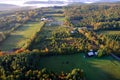 An aerial view of a hot air balloon floating over the Vermont country side