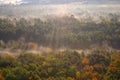 An aerial view of a hot air balloon floating over the Vermont country side