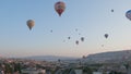 Aerial view from hot air balloon during Sunrise over the fairytale landscape hills of Kapadokya with morning light.