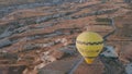 Aerial view from hot air balloon during Sunrise over the fairytale landscape hills of Kapadokya with morning light.