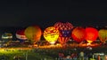 Aerial View of Hot Air Balloons Doing a Balloon Glow at Night on a Summer Evening Royalty Free Stock Photo