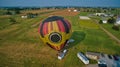 Aerial View of Hot Air Balloons Trying to Launch in a Wind as Seen by a Drone