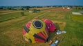 Aerial View of Hot Air Balloons Trying to Launch in a Wind as Seen by a Drone